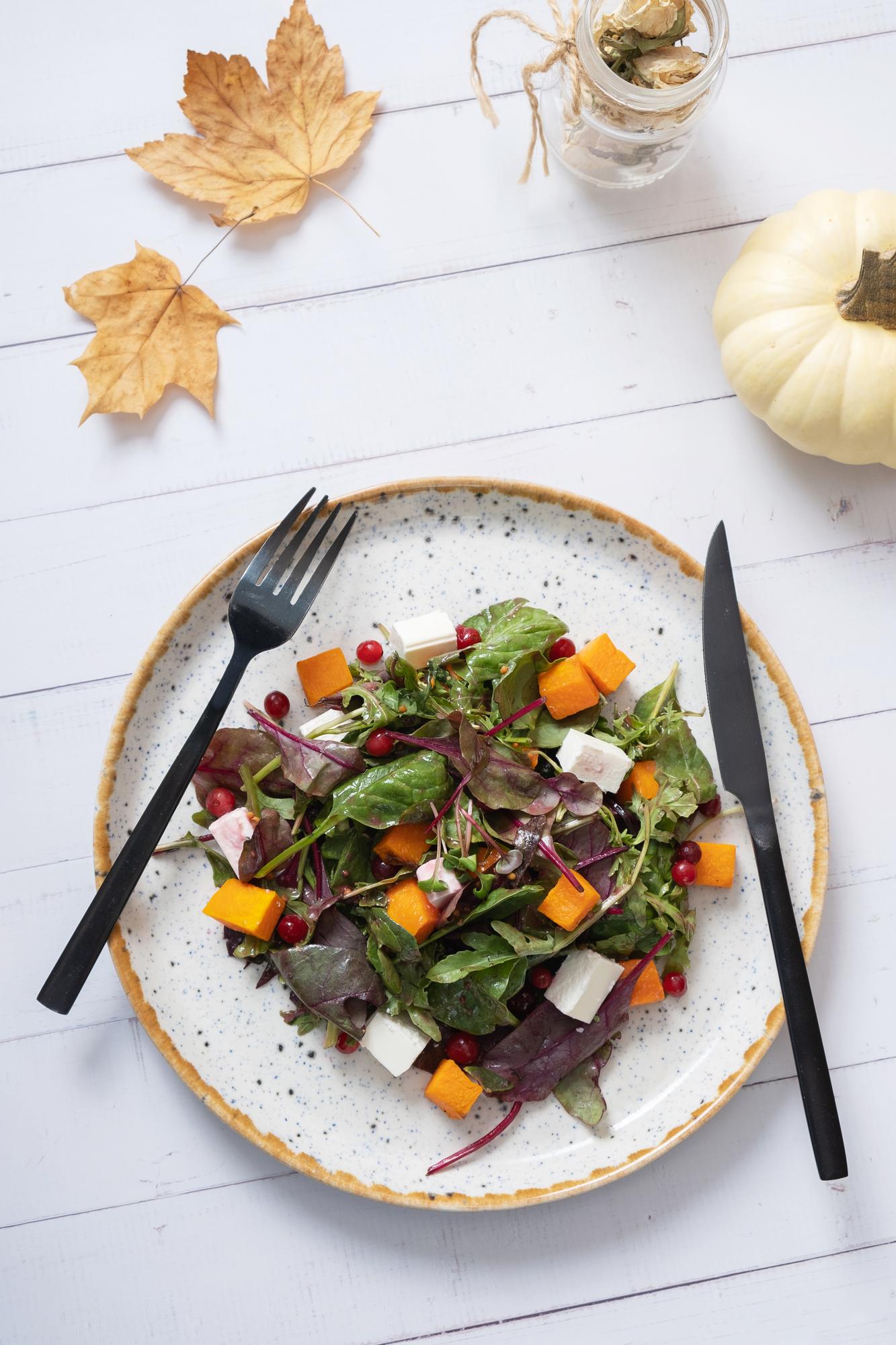 Plated seasonal salad on rustic table